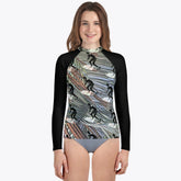 Adolescent in a distinctive black and white Surfer's Paradise rash guard
